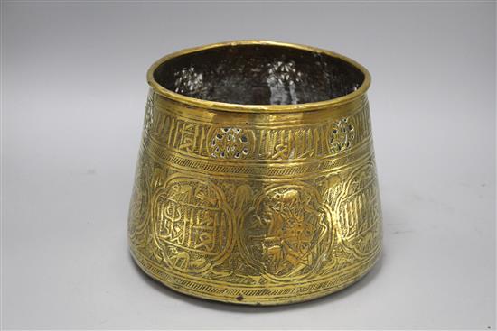 A Cairoware brass jardiniere, decorated with panels of figures and calligraphy, height 18cm, diameter 24cm